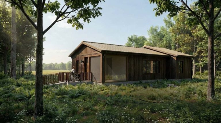 An image rendering of an accessible wooden cabin int he woods featuring a person in a wheelchair ramp entering the cabin.