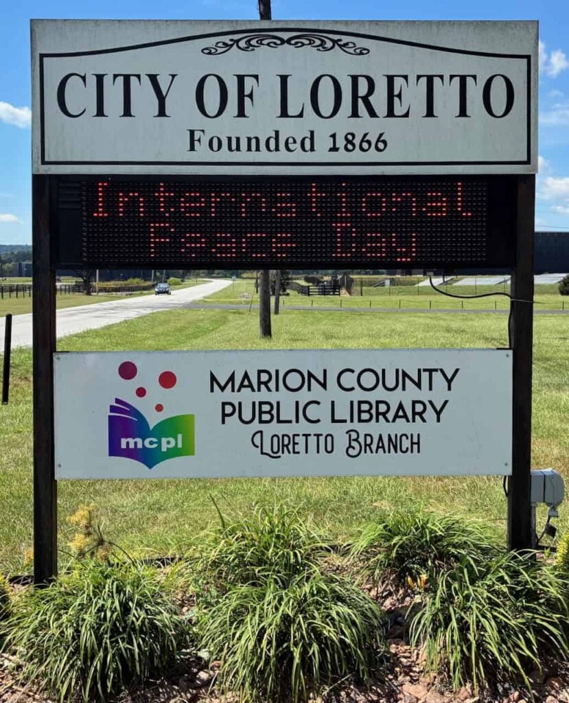 The city of Loretto, Ky., marquee displaying a sign that says "International Peace Day"