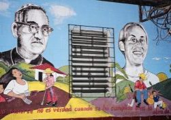 Colorful mural of St. Oscar Romero and Ann Manganaro with the text La muerte no es verdad cuando se ha cumplido bien la obra de la vida" (translation: "Death is not real when the work of life has been well fulfilled.")