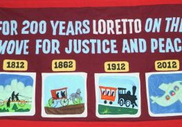 Banner reads "For 200 years Loretto on the move for justice and peace."