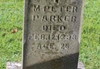 Gravestone bearing a cross, with the words, "M. Peter Parker. Died Feb. 12, 1893, Age 26"