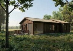 An image rendering of an accessible wooden cabin int he woods featuring a person in a wheelchair ramp entering the cabin.