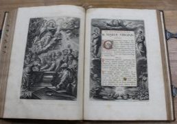 Two pages of an antique book displaying biblical images and text.
