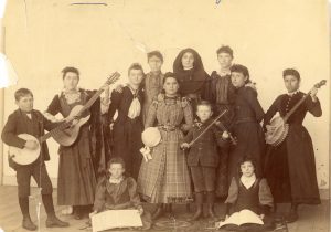 Archival photo of a Sister of Loretto with her class in 1890